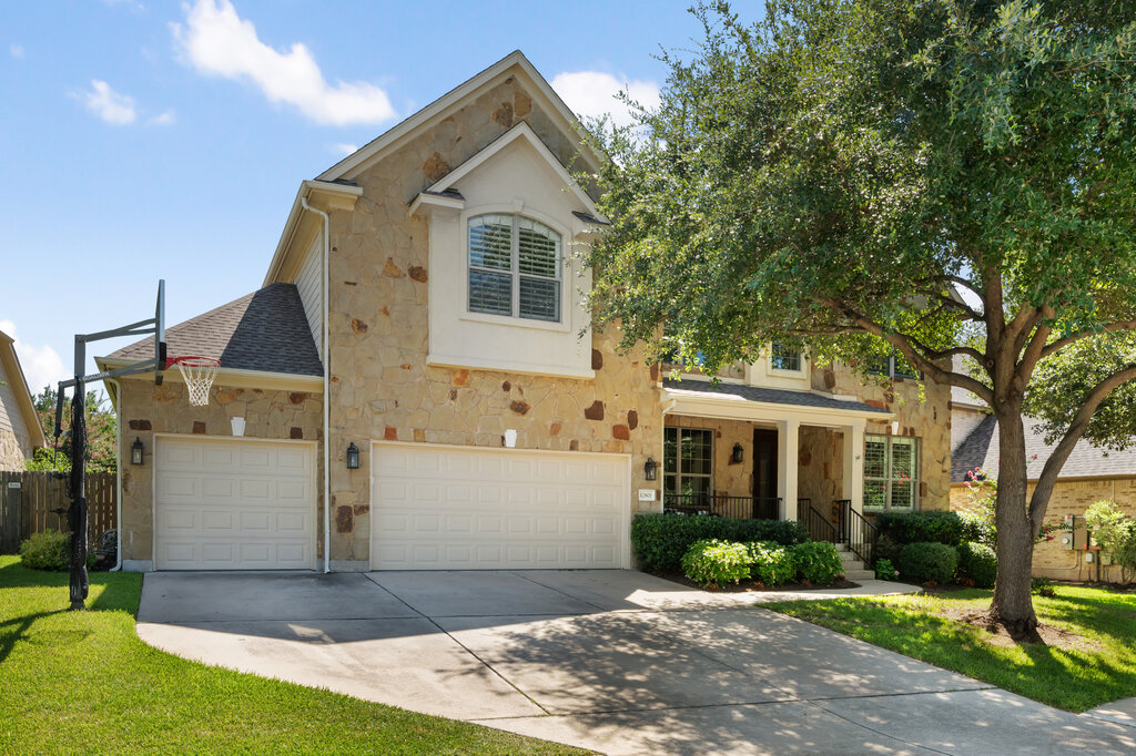 12801 Little Dipper Path Austin, TX 78732 - Photo 4 of 29 a front view of a house with a yard