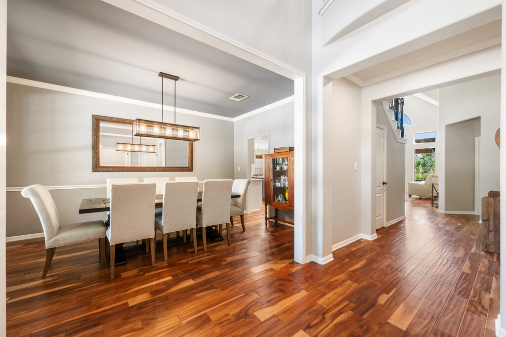 12801 Little Dipper Path Austin, TX 78732 - Photo 8 of 29 a view of a dining room with furniture and wooden floor