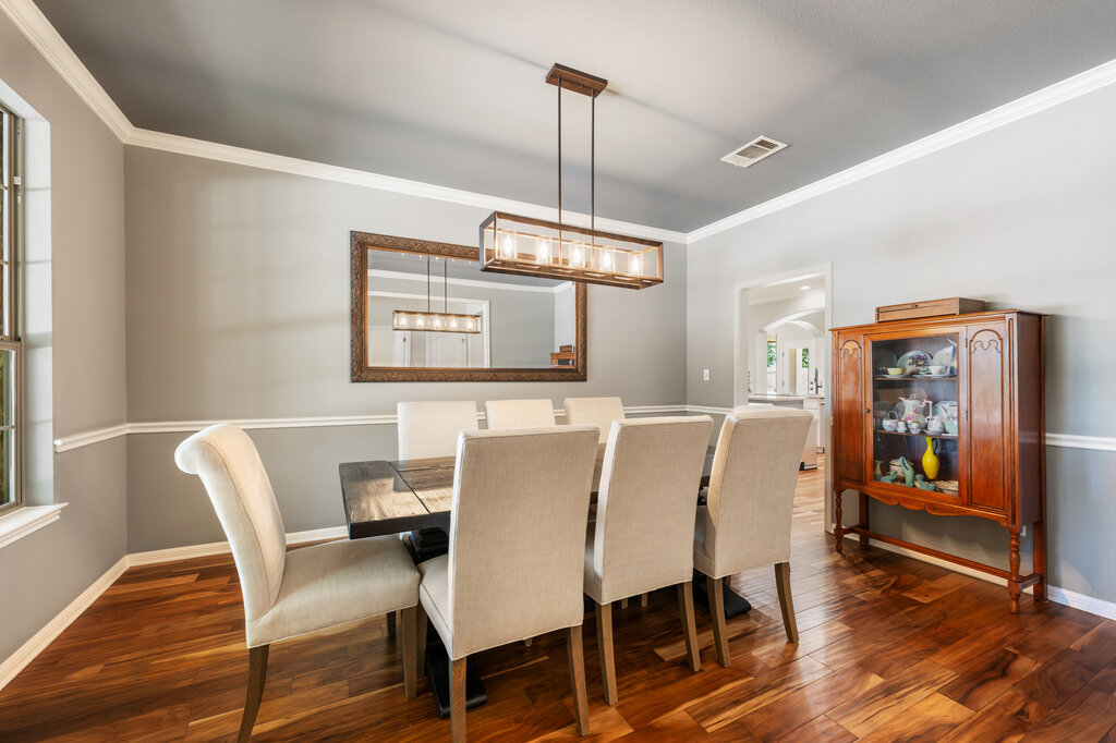 12801 Little Dipper Path Austin, TX 78732 - Photo 10 of 29 a view of a dining room with furniture window and wooden floor