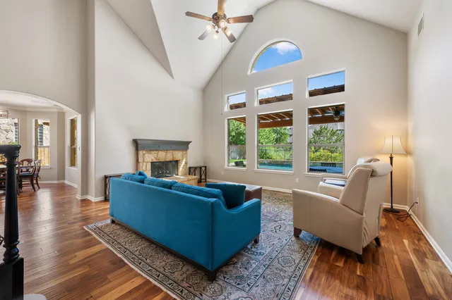 a living room with furniture and a fireplace