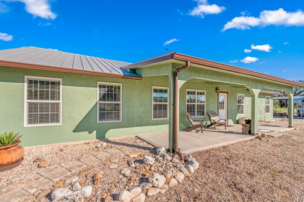 4980 West Ranch Road 1674 Junction, TX 76849 - Photo 18 of 23 a front view of a house with a patio