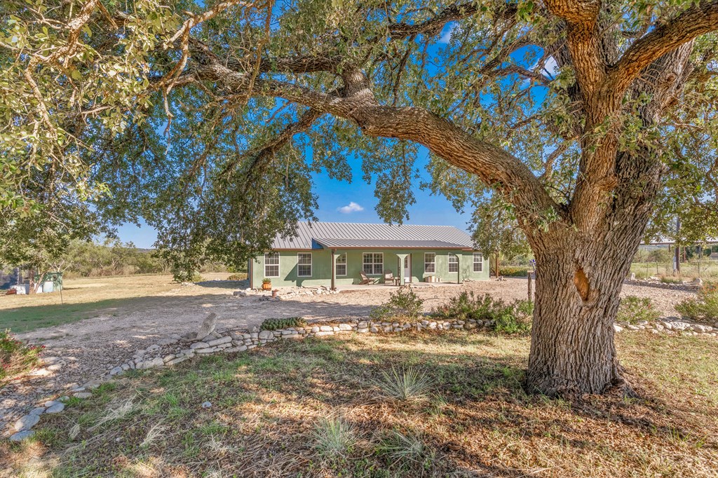 4980 West Ranch Road 1674 Junction, TX 76849 - Photo 2 of 23 a view of a house with a tree