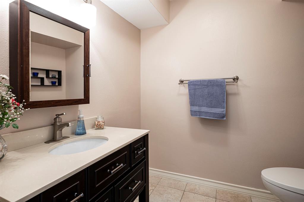 10757 Villager Road, Unit B Dallas, TX 75230 - Photo 18 of 36 Guest bath with custom vanity and walk-in shower