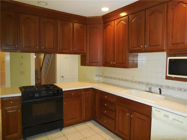 a kitchen with a sink and a stove