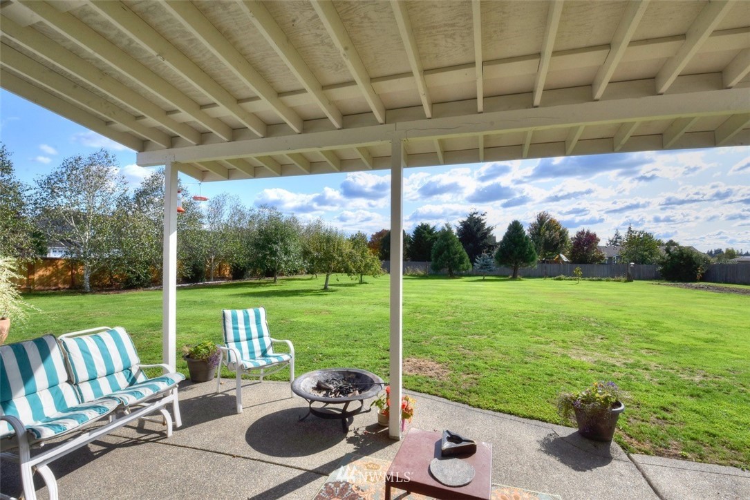 4841 181st Lane Southwest Rochester, WA 98579 - Photo 22 of 24 a view of a chair and tables in the patio