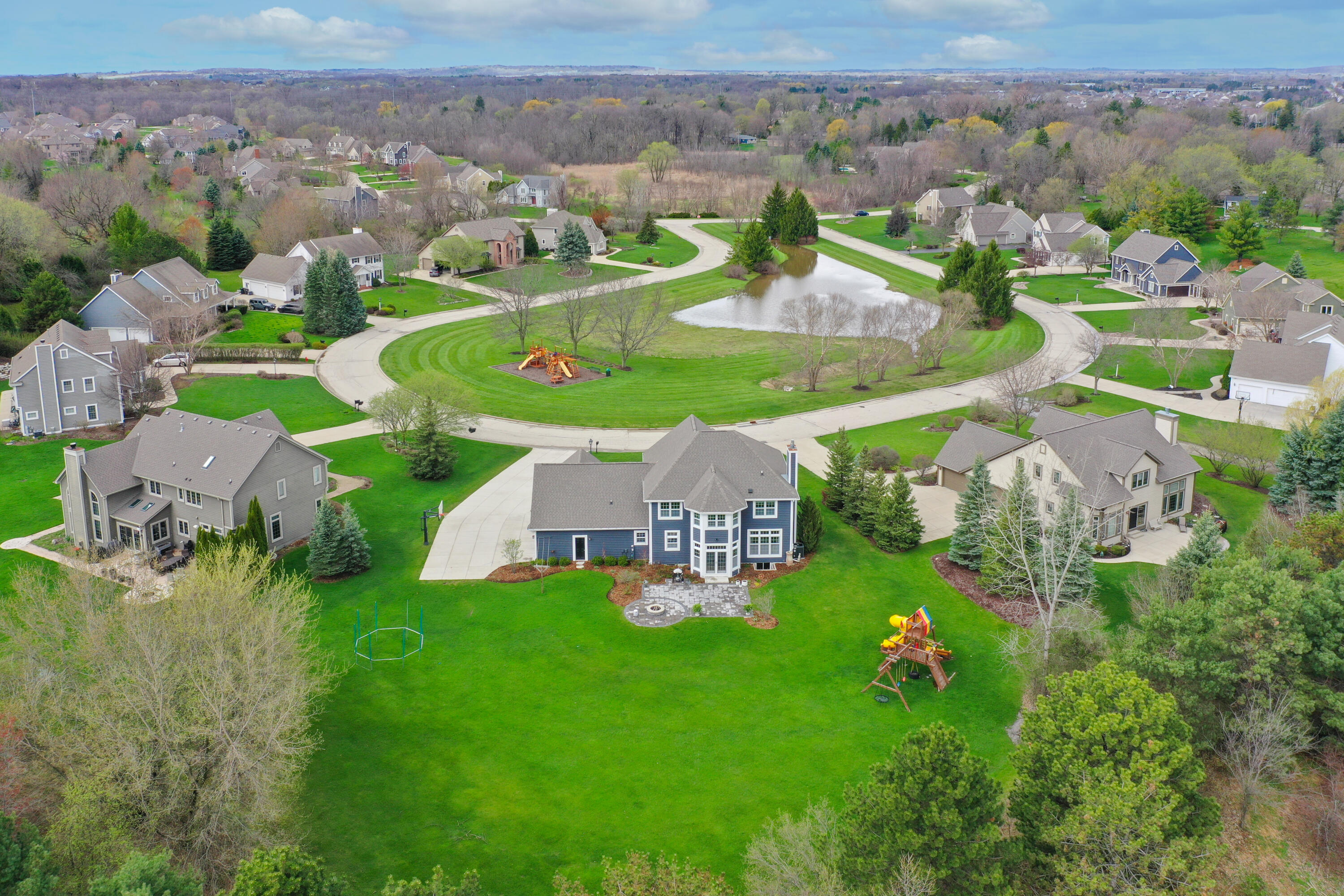 W223N3589 Ridgeside Court Pewaukee, WI 53072 - Photo 2 of 42 New roof 2021, huge backyard + Cul-de-sac has kids playset!