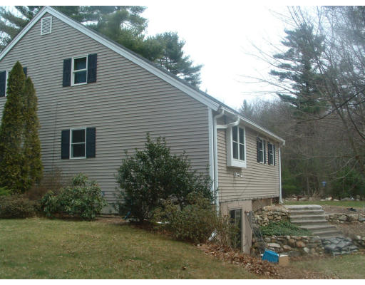 115 High Street Carver, MA 02330 - Photo 3 of 8 a view of a house with backyard