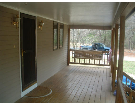 115 High Street Carver, MA 02330 - Photo 4 of 8 a view of an empty room with wooden floor and a window