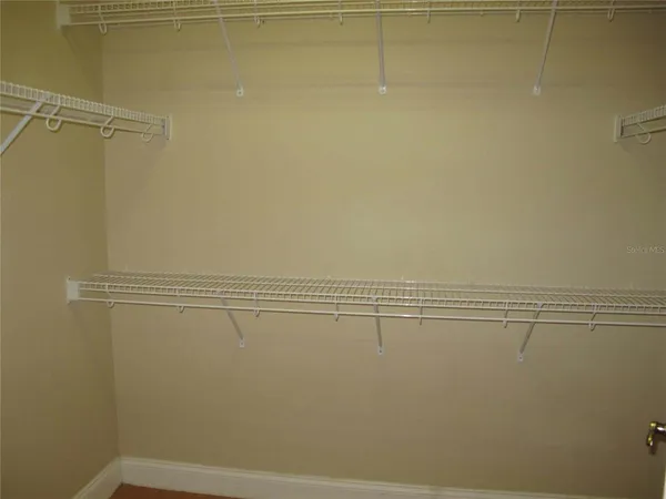 a view of a room with racks on the wall