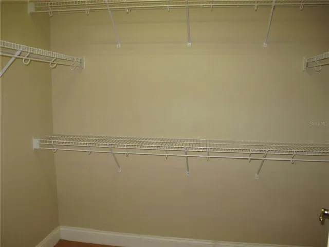 a view of a room with racks on the wall