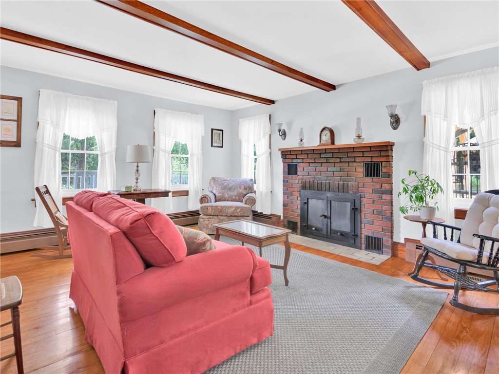 335 Eagle Peak Road Burrillville, RI 02859 - Photo 6 of 35 Entry into living room with brick fireplace