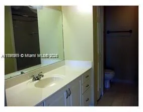 a view of a living room and kitchen