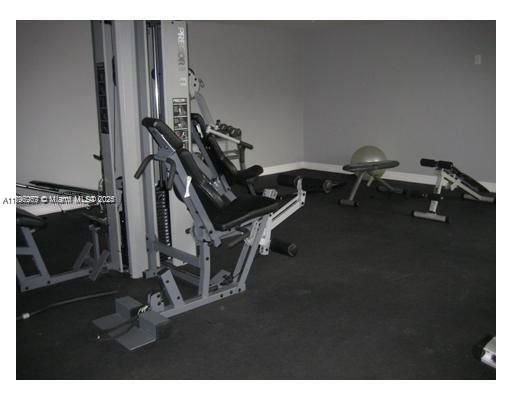 215 Southwest 42nd Avenue, Unit 905 Miami, FL 33134 - Photo 16 of 18 a room with gym equipment