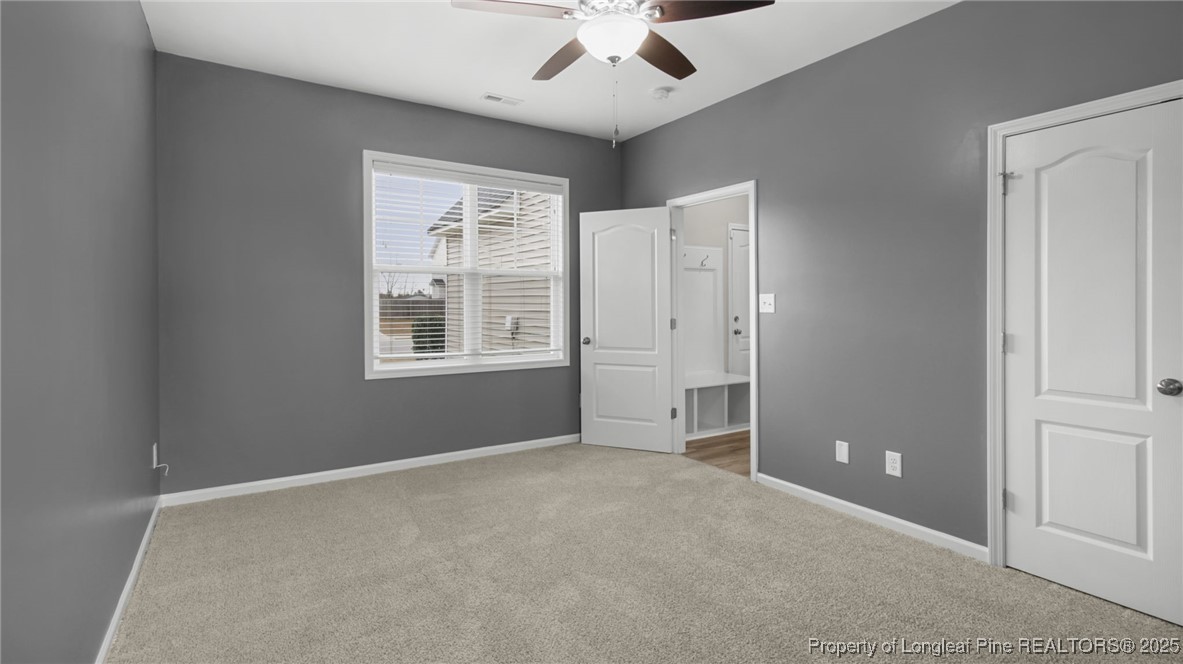 160 Chatfield Dr. Raeford, NC 28376 - Photo 19 of 32 an empty room with windows and fan