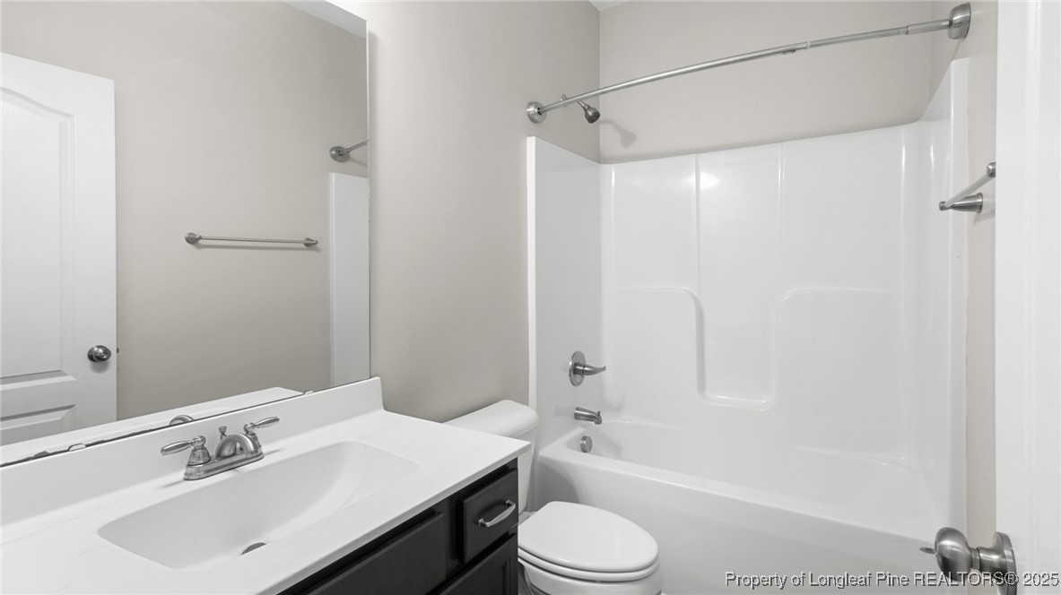 160 Chatfield Dr. Raeford, NC 28376 - Photo 20 of 32 a bathroom with a sink a toilet and shower