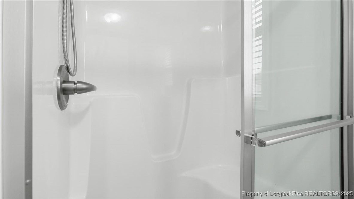 160 Chatfield Dr. Raeford, NC 28376 - Photo 25 of 32 a bathroom with a shower