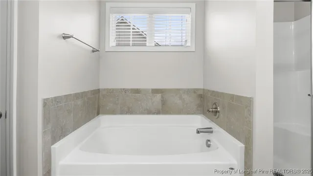 a bathroom with a sink double vanity and a mirror