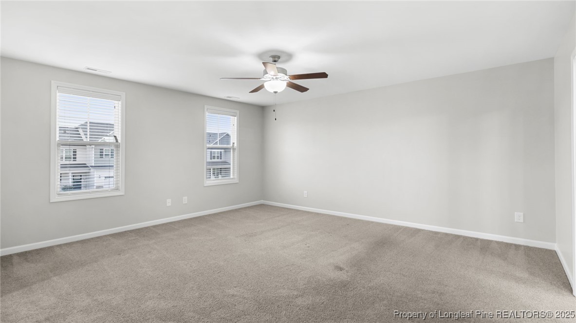 160 Chatfield Dr. Raeford, NC 28376 - Photo 30 of 32 an empty room with windows and fan