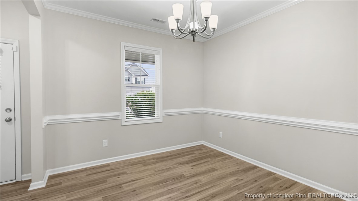 160 Chatfield Dr. Raeford, NC 28376 - Photo 6 of 32 a view of empty room with wooden floor and fan