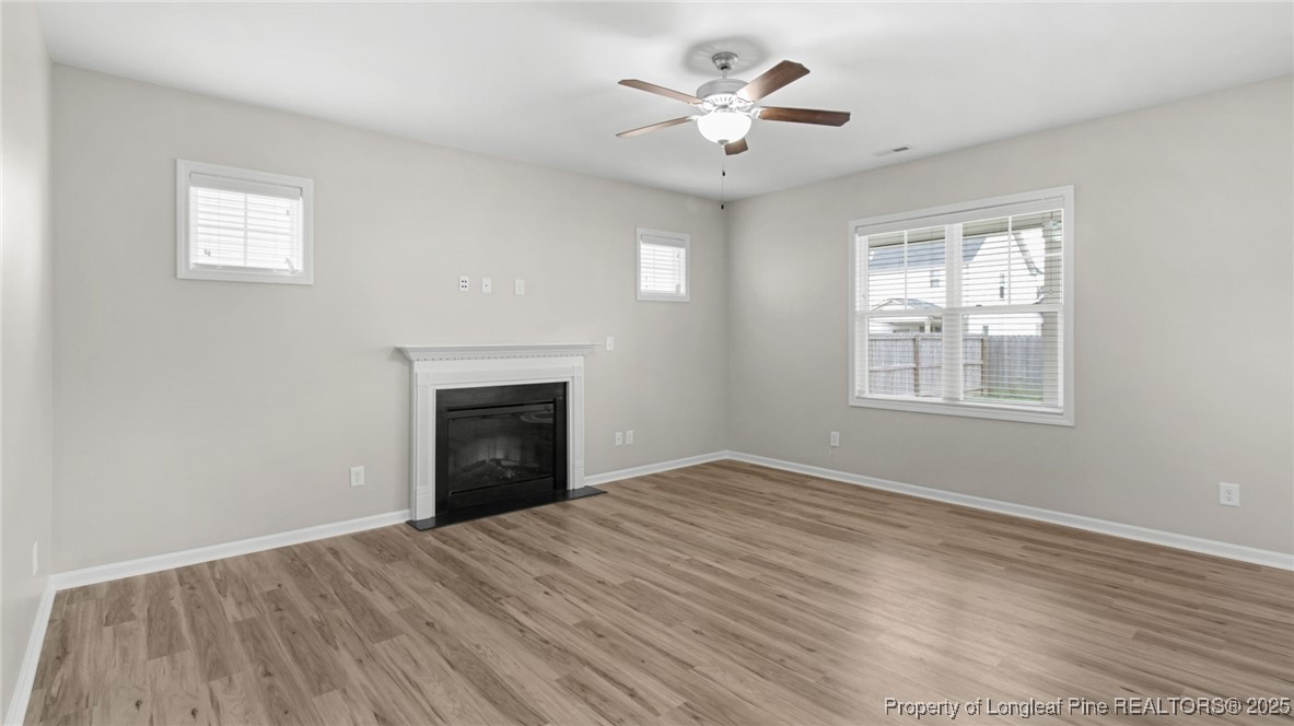 160 Chatfield Dr. Raeford, NC 28376 - Photo 8 of 32 a view of an empty room with a window and fireplace