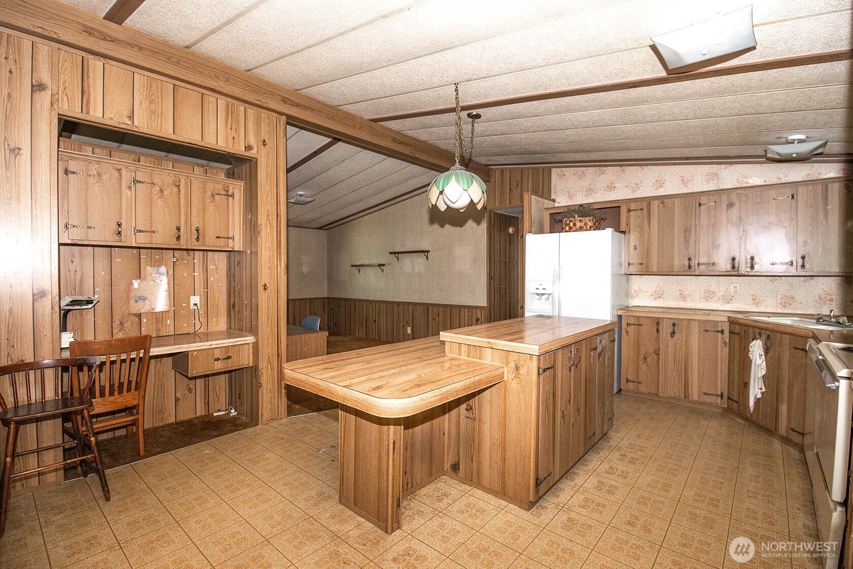 20115 49th Drive Southeast Bothell, WA 98012 - Photo 18 of 35 a kitchen that has a lot of cabinets in it and wooden cabinets