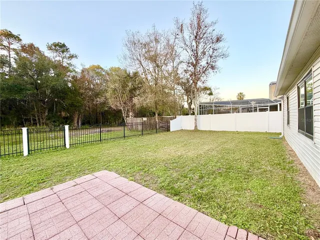 a view of a park with large trees