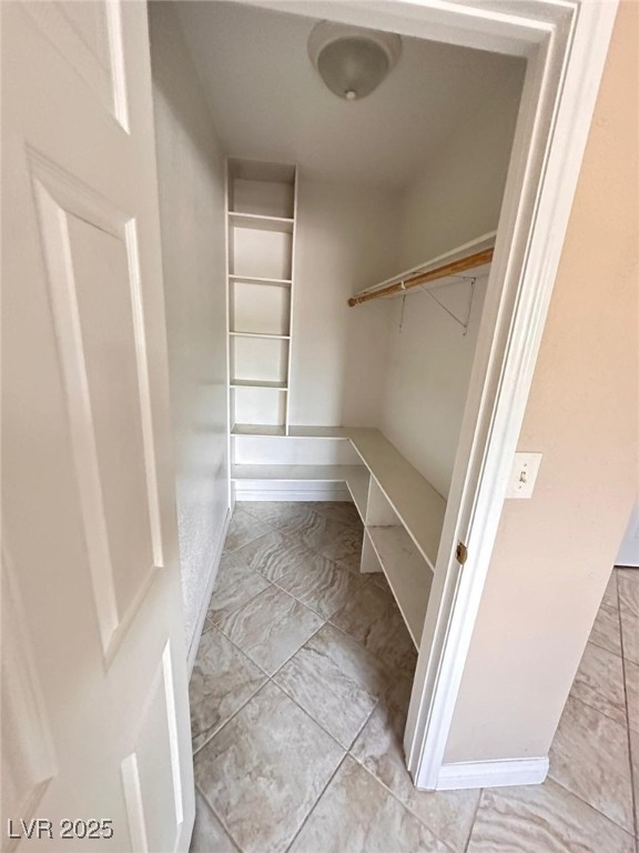 5346 South Swenson Street, Unit 35 Las Vegas, NV 89119 - Photo 4 of 19 Spacious closet featuring light tile patterned flooring