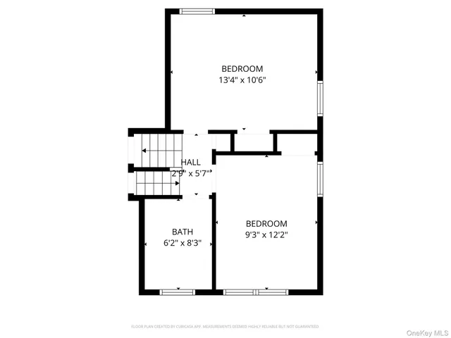 a picture of a bench in front of a wall