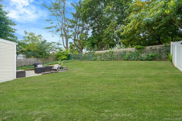 a view of a backyard with parked area