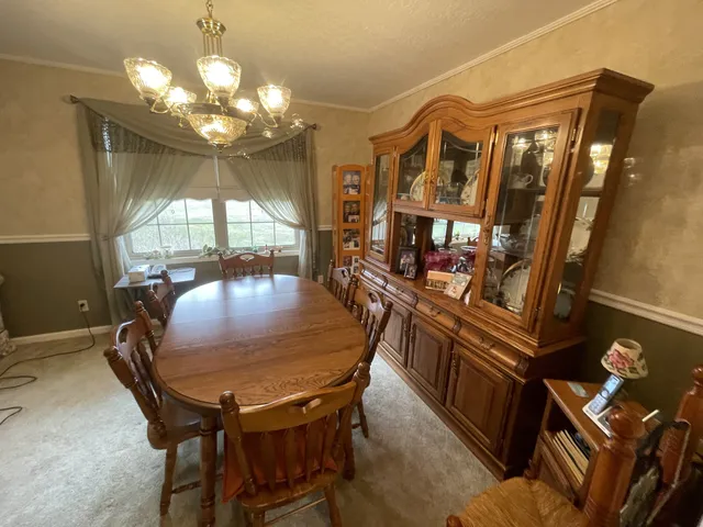 a kitchen with stainless steel appliances a refrigerator sink and cabinets