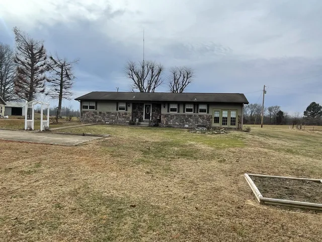 a view of a swimming pool with a yard