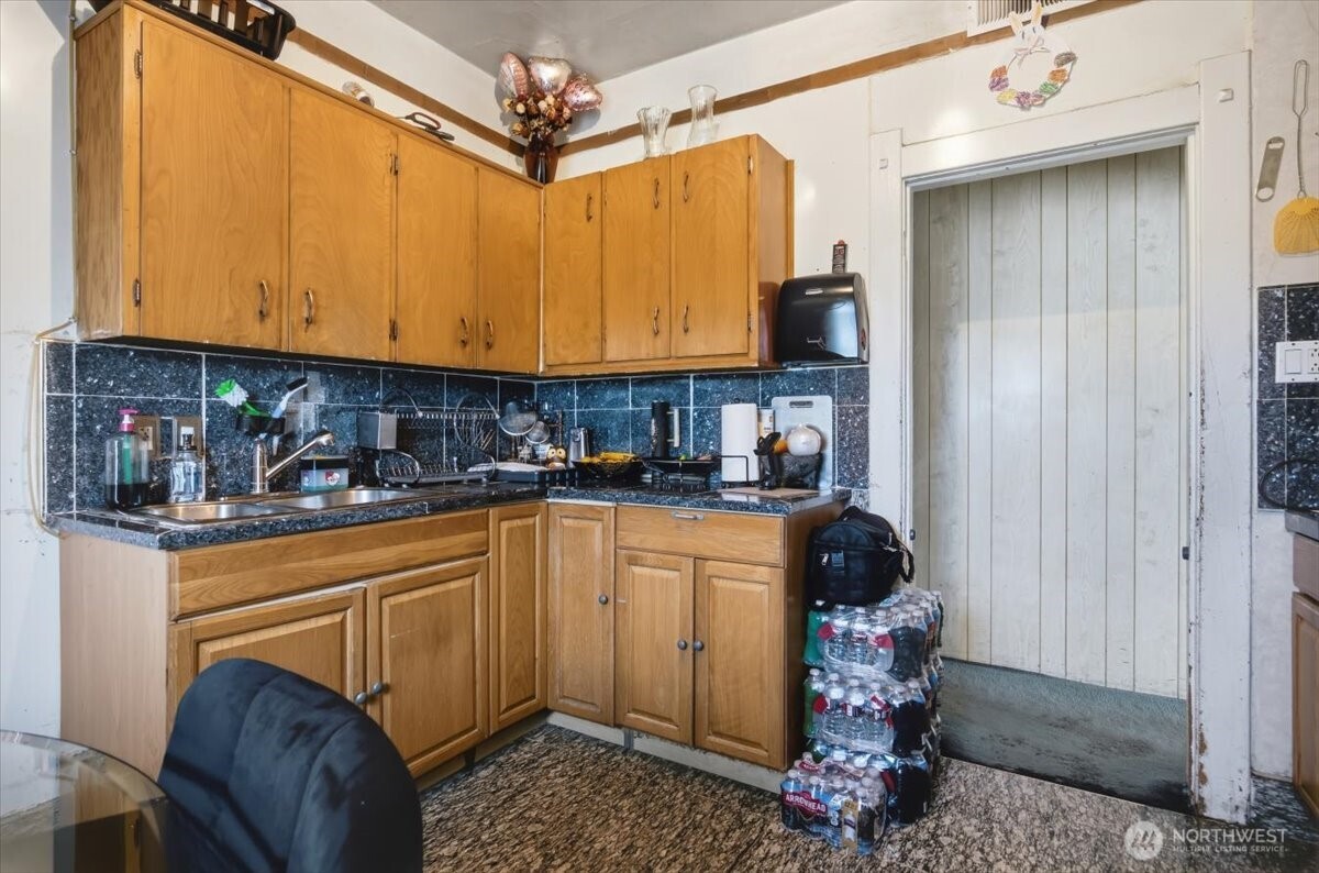 802 South 11th Avenue Pasco, WA 99301 - Photo 7 of 24 a kitchen with stainless steel appliances granite countertop a refrigerator a sink a stove and white cabinets