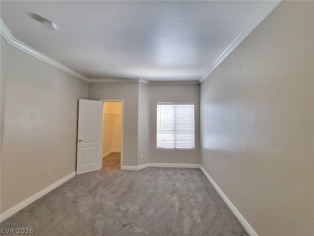 5525 West Flamingo Road, Unit 2040 Las Vegas, NV 89103 - Photo 7 of 15 Well-lit and carpeted room, offering a versatile space for rest or recreation.