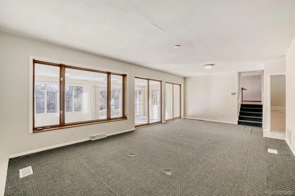 a view of an empty room with a window