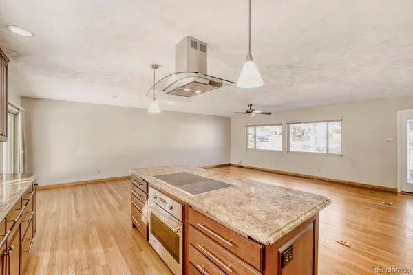 a view of a kitchen cabinets a sink and wooden floor