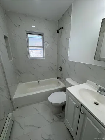 a bathroom with a sink mirror toilet and bathtub
