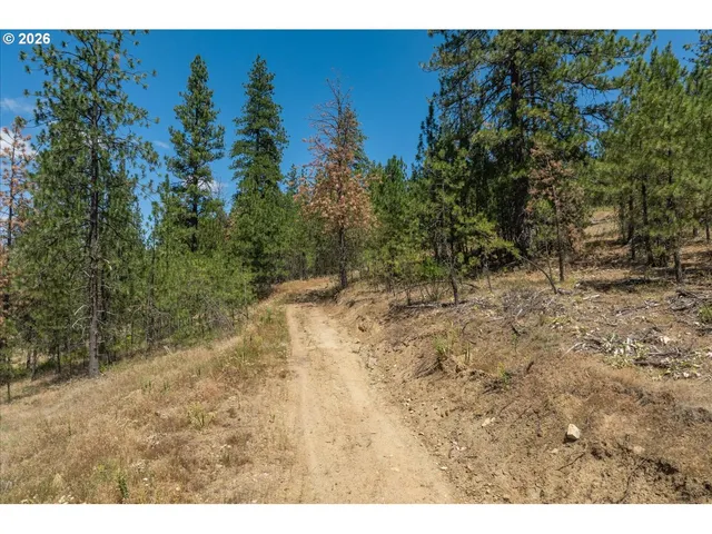 a view of a city street from a balcony