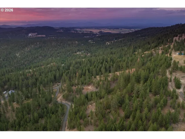 a view of a lake with a yard