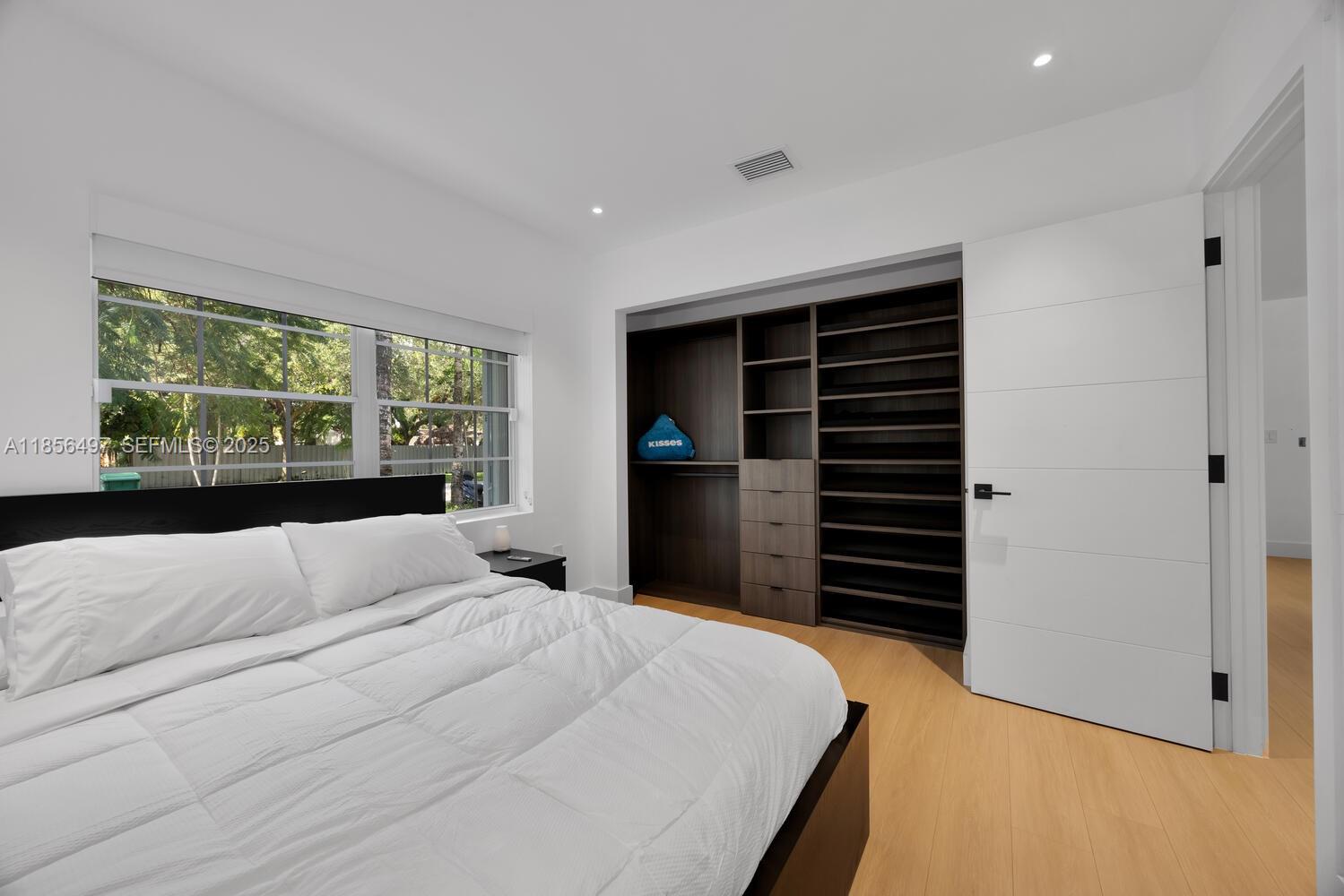 5827 Southwest 69th Court Miami, FL 33143 - Photo 12 of 18 a bedroom with a bed and a television