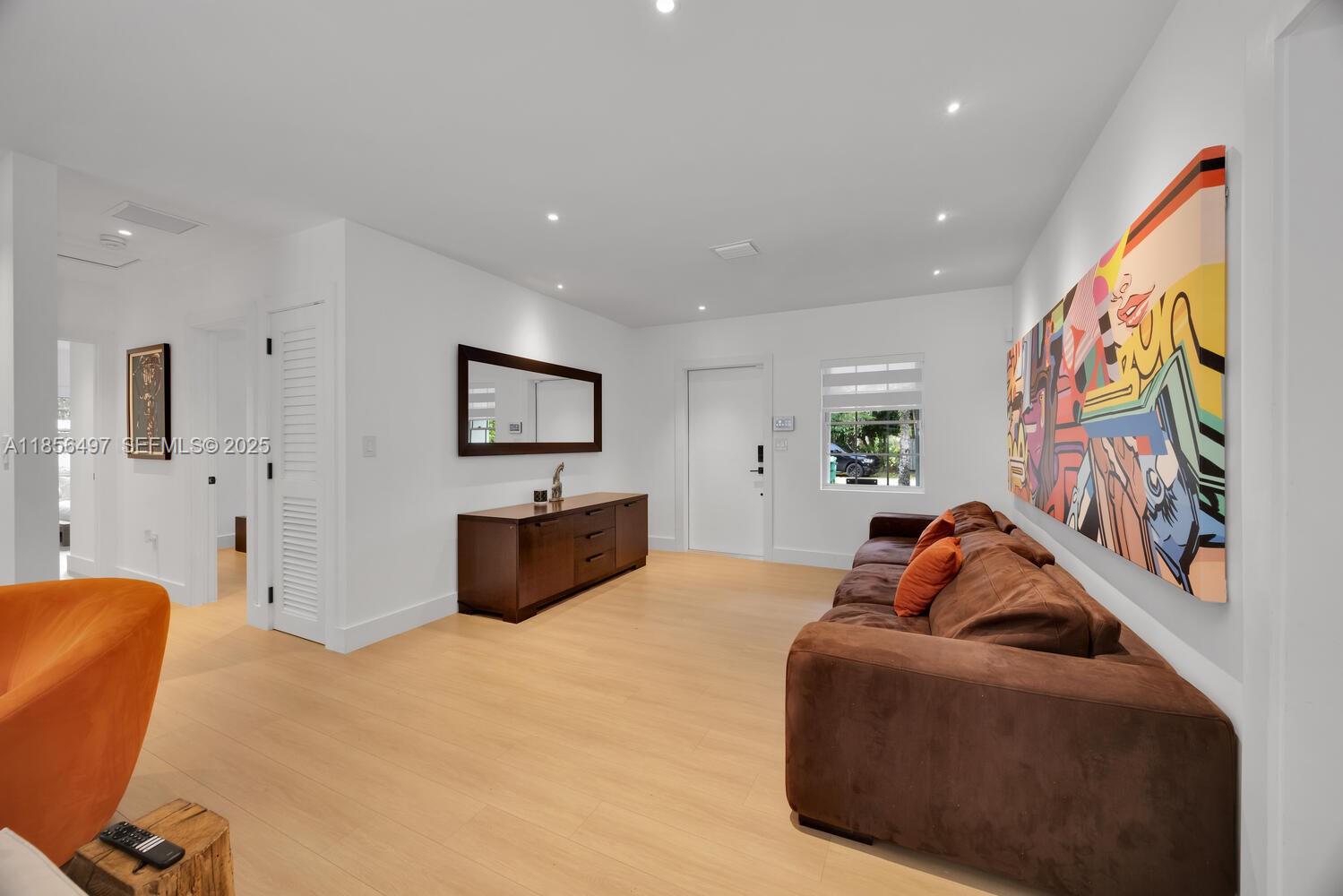 5827 Southwest 69th Court Miami, FL 33143 - Photo 3 of 18 a living room with furniture and a flat screen tv