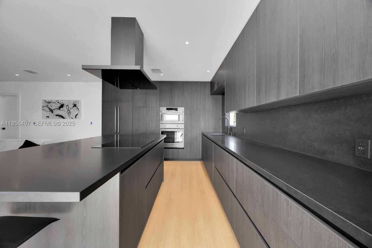 5827 Southwest 69th Court Miami, FL 33143 - Photo 6 of 18 a view of a kitchen with a sink and dishwasher