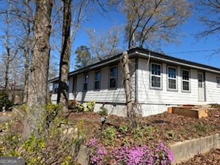 a house with trees in the background