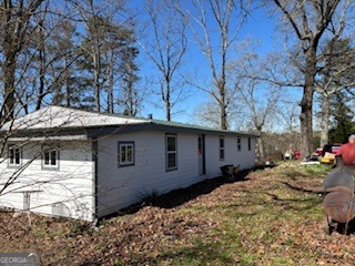 634 Duncan Road Oxford, GA 30054 - Photo 2 of 2 a backyard of a house with large trees and wooden fence
