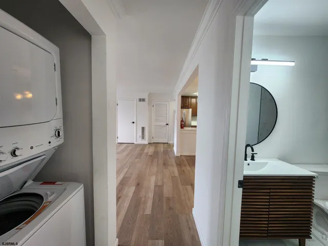 a view of a bathroom from a hallway