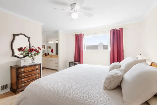 a bedroom with a bed and a dresser