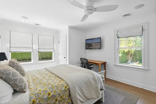 a bedroom with a large bed and a window