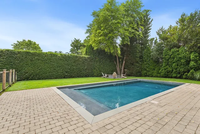 a view of swimming pool with a yard