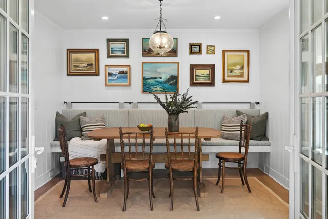a dining room with furniture and window