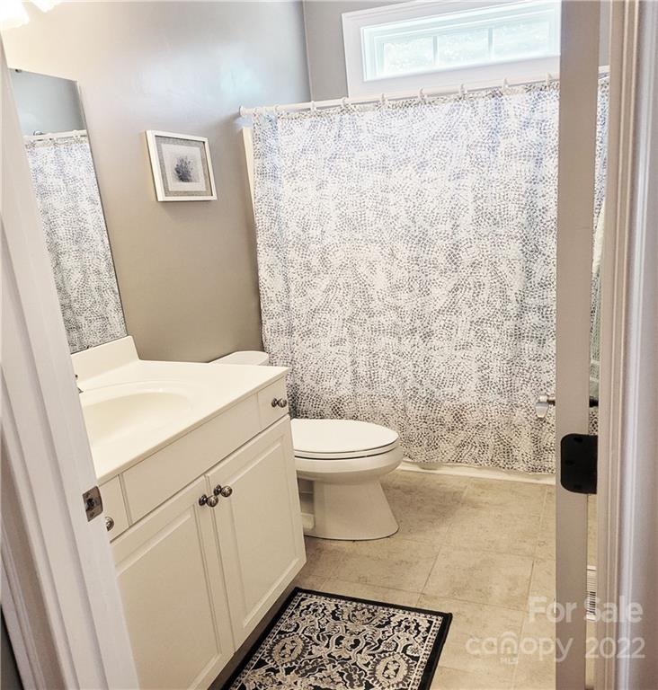 679 Presbyterian Road Mooresville, NC 28115 - Photo 11 of 25 a bathroom with a toilet and a shower
