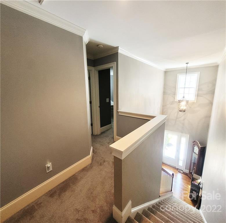 679 Presbyterian Road Mooresville, NC 28115 - Photo 13 of 25 a bedroom with a bed and wooden floor